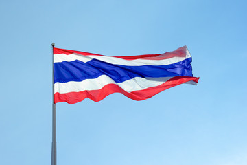 Flag of Thailand under blue sky