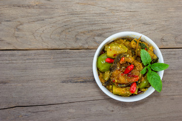 Spicy Fried Stir Catfish on wood background