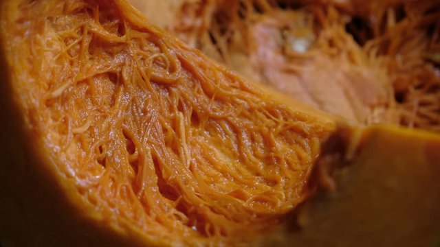 Close up of raw Fairytale pumpkin Cut In Half With Slice, Slider Shot