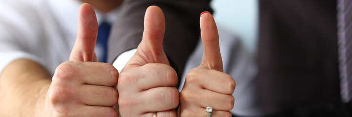 Group of people show OK or confirm with thumb up during conference closeup. High level quality...