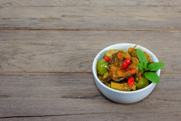 Spicy Fried Stir Catfish on wood background