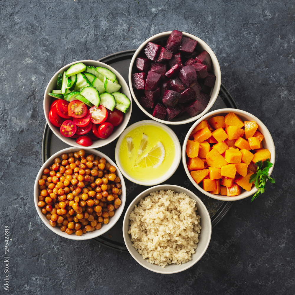 Poster Healthy vegetarian ingredients for cooking moroccan salad. Chickpeas, Baked pumpkin and beets, quinoa and vegetables top view copy space