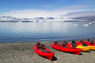Kayaks on the shore of Jokulsarlon glacier lagoon, south Iceland, Europe. Selective focus