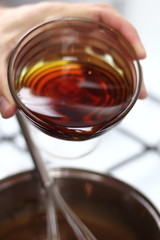 Pouring treacle syrup into chocolate mixture