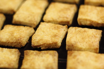 Freshly baked cookies in baking tray