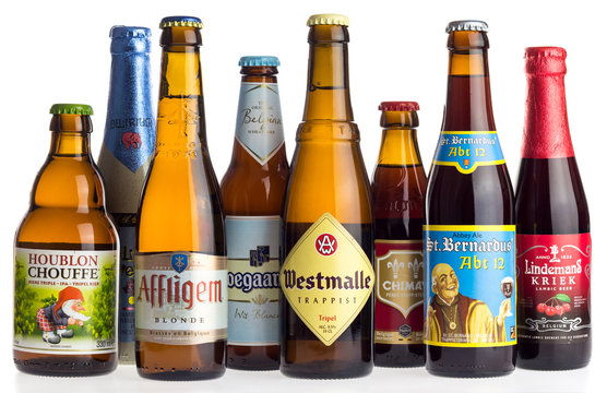 GRONINGEN, NETHERLANDS - APRIL 16, 2017: Collection of Belgian La Chouffe, Affligem, Hoegaarden, Westmalle, Delerium, Lindemans,  Chimay and St. Bernardus beers isolated on a white background