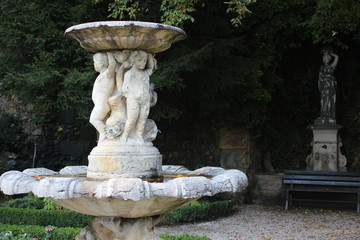 Ancient fountain in the castle. Fountain with angels.