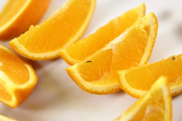 Fototapeta na wymiar Orange slices on plate