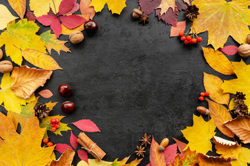 Autumn composition. Wreath made of autumn leaves on black background. Round frame. Flat lay. Copy space. Top view