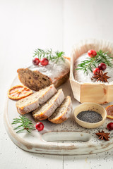 Tasty poppy seed cake for Christmas on white table
