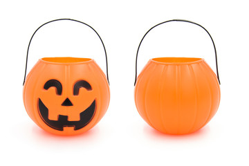 Halloween cute plastic toy pumpkin head basket closeup isolated on white background