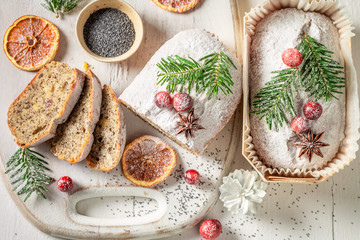 Top view of poppy seed cake for Christmas with orange