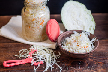 Plate with sour cabbage. This is a useful fermented product. Sour cabbage is rich in vitamins and is used in many dishes of different nations. The fermentation process does not destroy nutrients. 