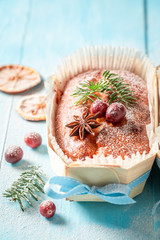 Sweet and rustic Fruitcake for Christmas bakedon blue table
