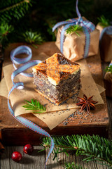 Homemade poppy seed cake for Christmas packed in paper