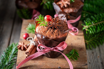 Tasty and homemade gingerbread muffin for Christmas on wooden box