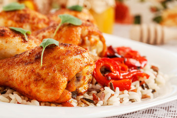 Indian cuisine: roasted chicken with rice and vegetables.