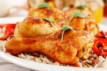 Indian cuisine: roasted chicken with rice and vegetables.