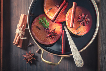 Top view of sweet mulled red wine with spices