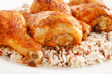 Indian cuisine: roasted chicken with rice and vegetables.