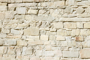 Wall of the old castle made of sandstone.