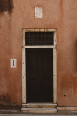 Fototapeta premium old wooden door in brick wall
