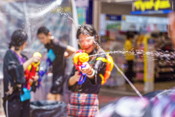 Songkran Festival or Songkran is celebrated in Thailand as the traditional New Year's Day from 13 to 15 April. People getting soaked during Songkran. - 295435803
