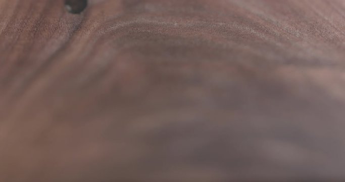 Focus pull of oil finished black walnut wood surface