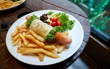 Breakfast - Jumbo sausage wrap with egg, fries, tomato and vegetable