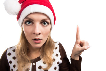 Beautiful christmas santa woman pointing up