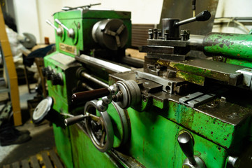 Metalworking workshop, metal processing machines. Levers of control of the machine.