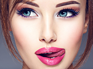 Emotional  young woman with beautiful big blue eyes.