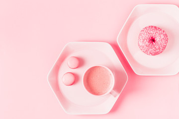 Breakfast with coffee on a pastel pink background