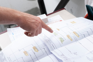 workmen and engineer working an planing on the job showing hands