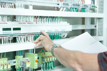 workmen and engineer working an planing on the job showing hands
