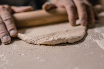 A working day at the bakery - the baker prepares the dough for baking - an interesting and tasty profession