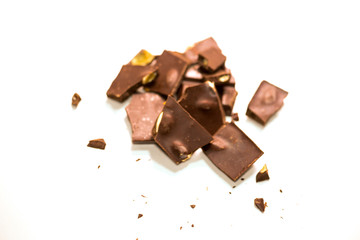 chocolate pieces pile with almonds isolated