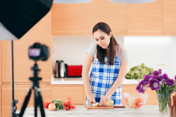 Female Food Vlogger Filming a Cooking Video in her Kitchen