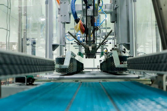 Close up Belt conveyor glass bottles into beverage filling machine