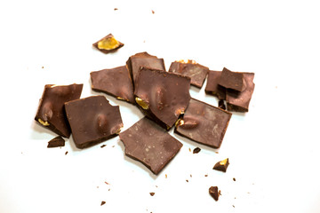 chocolate pieces pile with almonds isolated