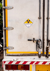 Radiation warning sign on the Dangerous goods transport label Class 7 at the container of transport truck