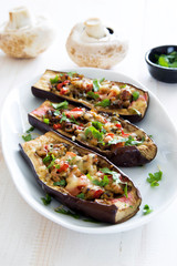 Eggplants stuffed with meat, mushrooms and tomatoes
