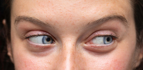 Female blue eyes looking to side close up