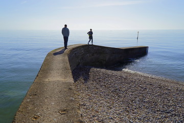 Fototapeta na wymiar People walk on path to the sea in Devon