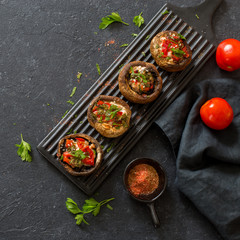 Mushrooms filling with tomatoes, sweet peppers and chicken