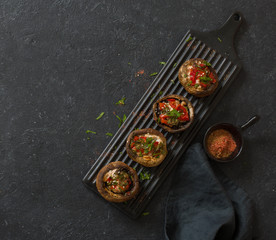 Mushrooms filling with tomatoes, sweet peppers and chicken