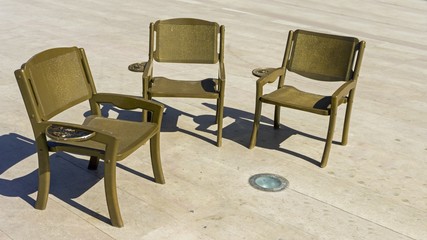 sclose up from golden chairs in a circle