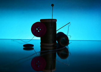 accessories for sewing on a blue background