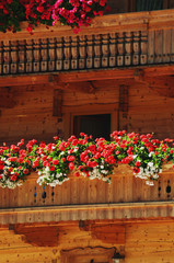 Fototapeta na wymiar Traditional balcony, with geraniums, in Tyrol, Austria 