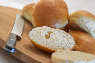 Home made sandwiches with bread and knife against white background